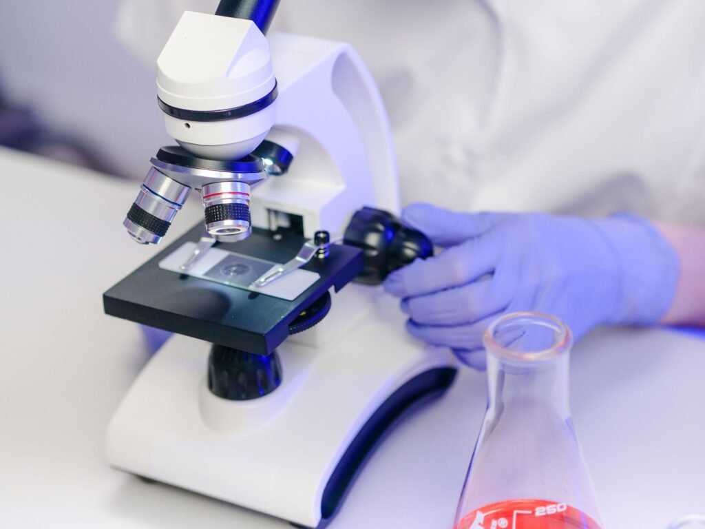 A scientist examining sample slides in a modern laboratory