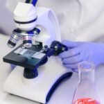 A scientist examining sample slides in a modern laboratory