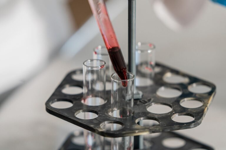 Liquid being transferred into test tubes in a laboratory